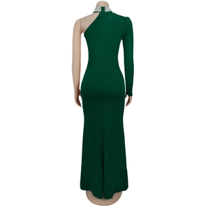 Close-up of the back view of a dark green off-shoulder dress with sparkling rhinestones
