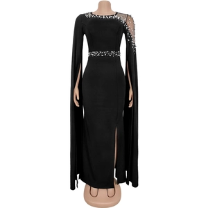 Detail of evening gown with rhinestone beading, cape sleeves, and side slit design