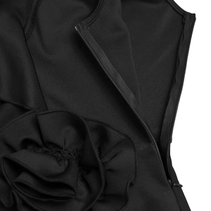 Close-up of invisible back zipper and handmade 3D floral detail on black elegant dress
