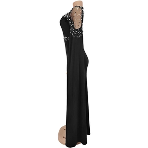 Detailed view of sheer mesh cape sleeves with elegant pearl and rhinestone accents