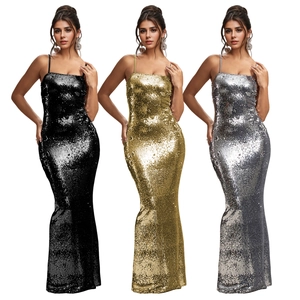 Elegant sequin evening gown in black, gold, and silver with a slim mermaid silhouette