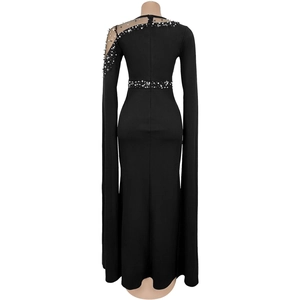 Detailed back view of a black evening gown featuring pearl and rhinestone embellishments