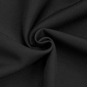 Detailed macro view of the premium black ribbed knit fabric with elegant soft texture