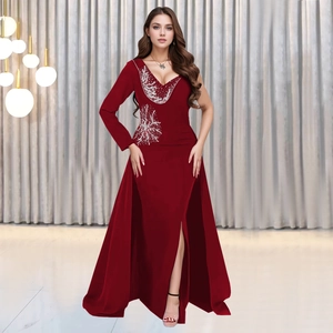 Detail of silver bead embroidery and deep V-neckline on this elegant red evening gown