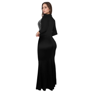 Detail of elegant black evening dress showing silver rhinestone embroidery on neckline