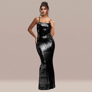 Close-up of sparkling black sequins and spaghetti strap on an elegant fishtail dress