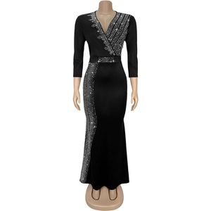 Detail of elegant black V-neck evening gown with sparkling rhinestones and slim fit design