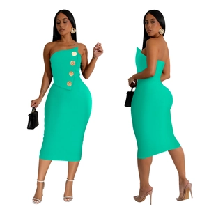 Detail view of mint green bodycon dress with gold buttons and asymmetric folded neckline