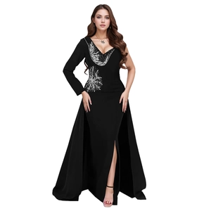 Detail of silver sequin embroidery on asymmetric black V-neck evening gown dress