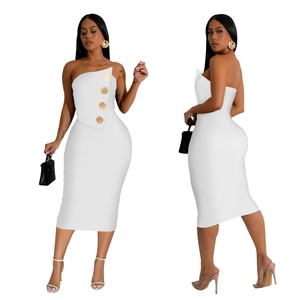 Detail of white tube midi dress featuring side panel with decorative gold buttons