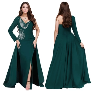Detailed view of dark green satin dress featuring silver beadwork and side slit design