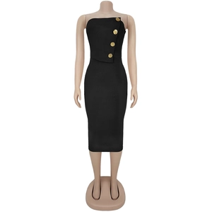 Detail of elegant gold embossed buttons on a black strapless slim fit midi dress