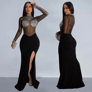 Elegant black evening gown with sheer mesh rhinestone sleeves and sexy high side slit