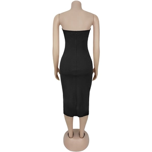 Detail view of the seamless invisible back zipper on a black strapless midi bodycon dress