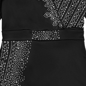 Detail of silver rhinestones and rectangular sequins on an elegant black V-neck dress