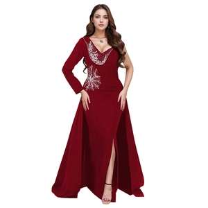 Detail of burgundy evening gown showing asymmetric silver sequins and beadwork embroidery