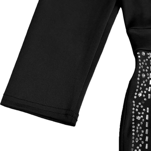 Macro view of black dress featuring silver rhinestones and premium stitching detail
