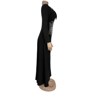 Detail view of the black V-neck maxi dress featuring sparkling rhinestone side waist decoration
