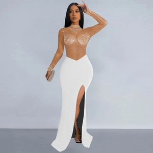 Detail of sheer mesh bodice with silver rhinestones and white high slit evening dress