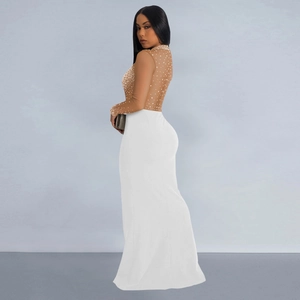 Detail of sheer mesh bodice with sparkling rhinestones on a white slit evening gown