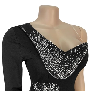 Close-up of black V-neck dress with silver rhinestones and transparent shoulder straps