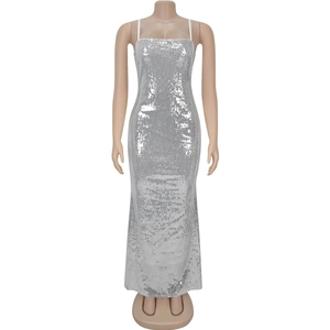 Detailed close-up of silver sequins on a formal spaghetti strap evening gown