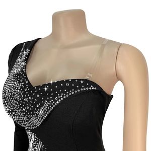 Detail of the elegant V-neckline featuring shimmering silver rhinestones on the black dress