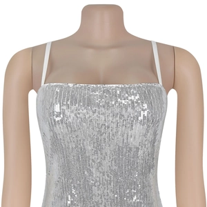 Macro detail of silver sequins on a party camisole top with shimmering reflective texture