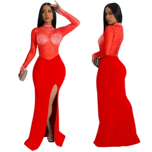 Detail of red mesh evening dress with silver rhinestones and sexy side slit design