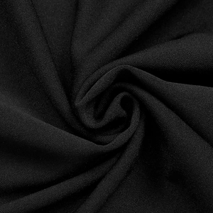 Detail of black knitted fabric texture with elegant folds and soft crepe material