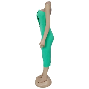 Close-up of bright green tube dress featuring a slim fit cut and decorative buttons