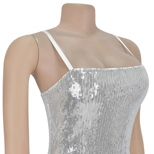 Detail of silver sequin fabric and thin straps on the slim-fit evening party dress