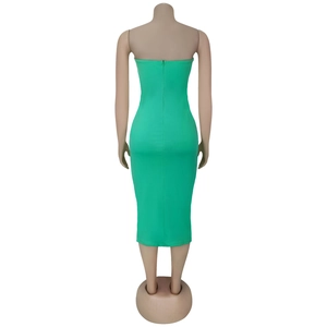 Close-up of grass green strapless midi dress featuring hidden back zipper and slim fit cut