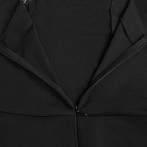Close-up of the invisible zipper and fine stitching on a black V-neck rhinestone dress