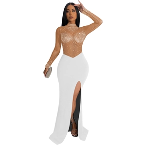 Detail of sheer mesh bodice with rhinestones and high slit on white evening dress