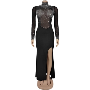 Close-up of sheer mesh sleeve with sparkling silver rhinestones on a sexy black dress
