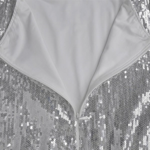 Macro shot of silver sequins dress detail with high-quality invisible zipper and white lining