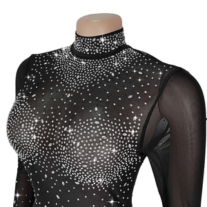 Detail of high neck black sheer mesh top featuring sparkling rhinestone geometric patterns
