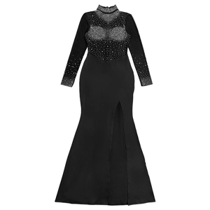 Detail view of black evening dress with sheer mesh, sparkling rhinestones, and high side slit