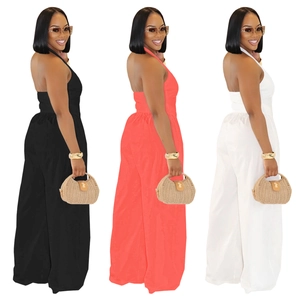 Three-color comparison of backless halter wide-leg jumpsuits in black, coral, and white