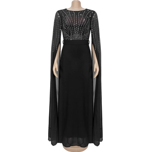 Detailed view of black chiffon dress with silver rhinestones and sheer mesh bodice