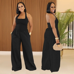 Women's black halter neck wide leg jumpsuit with open back and side pockets for summer