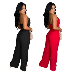 Detail view of bow-tie bandeau top and high-waist wide-leg pants set in red and black