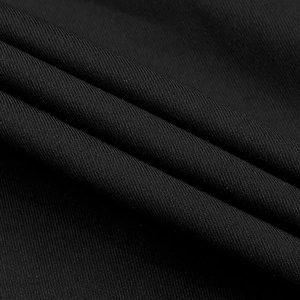 Detailed macro view of black mesh fabric with slanted twill texture and sparkly rhinestones