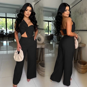 Women's black two-piece set featuring bow knot crop top and high waist wide leg pants