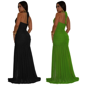 Detail view of ruched fabric and backless halter design on long slit dresses