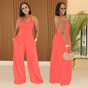 Women's backless halter jumpsuit in coral orange with elegant wide leg cut and pockets