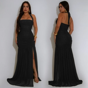 Detail view showing ruched texture and high side slit of black halter neck evening dress