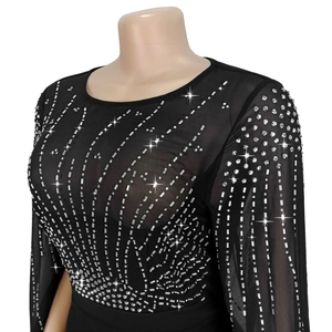 Detail of black mesh top with sparkling silver rhinestones in a striped pattern