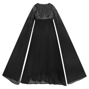 Detail of elegant black dress featuring shimmering rhinestones and sheer mesh sleeves